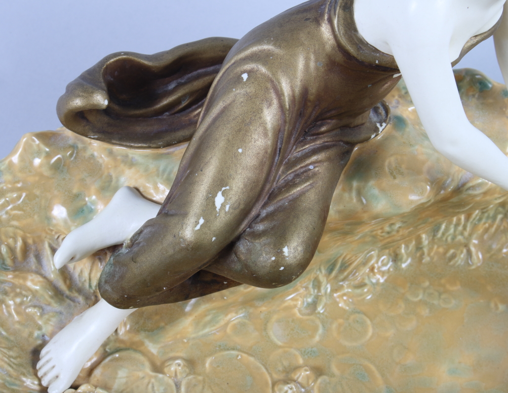 A Honenstein Art Nouveau table centre, formed as a girl sitting by a pond feeding a duck (damages - Image 2 of 8