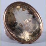 A Georgian yellow metal mounted smoky quartz seal, engraved with symbols of Masonic interest