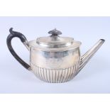 A George III silver teapot, London 1799, engraved crest, 16oz troy approx