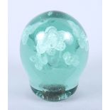 A Sunderland green glass dump weight with floral decoration, 4" high