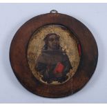 A late 18th century oil on copper, St Francis of Assisi, 6 1/4" dia, in circular mahogany frame