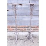 A pair of wrought iron pricket candlesticks, 43" high