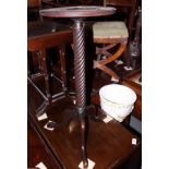 A Georgian design mahogany kettle stand, on spiral turned support and tripod splay feet, 12" dia