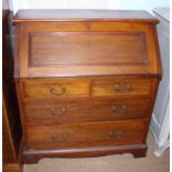 A late Victorian walnut fall front bureau with fitted interior over two short and two long