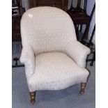 A late 19th century tub chair, upholstered in a cream fabric, on turned and castored supports