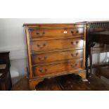 A batchelor's yew chest of four long drawers, on bracket feet, 30" wide