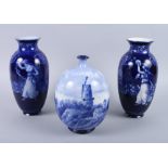 A pair of Doulton Burslem "Morrisian" blue and white figure decorated vases, 8 1/2" high, and a