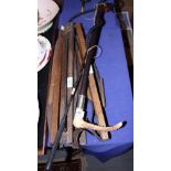 Five game carriers, various, a riding crop with horn handle and silver mount and one other riding