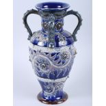 A Doulton Lambeth sprig and incised decorated four-handled vase, 10 1/2" high