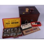 A collection of early 20th century games, in mahogany box