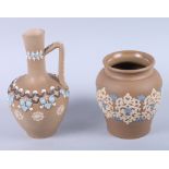 A Doulton Lambeth silicon sprig decorated jar, 5" high, and a similar jug, 7" high