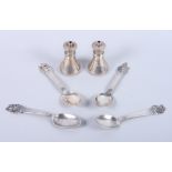 A set of four Norwegian silver spoons with cast terminals and a pair of silver salt shakers