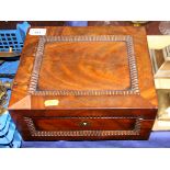 A late 19th century figured mahogany work box with part fitted interior, 12" wide