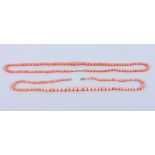 A graduated coral bead necklace with 9ct gold clasp, together with another similar coral bead