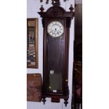 A mahogany cased Vienna regulator wall clock with compensatory pendulum and striking movement, 48"