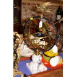 A brass and copper armillary sphere, on marble base