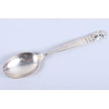 A Georg Jensen "Acorn" pattern silver pickle spoon/fork, 6" long