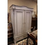 A Continental painted armoire enclosed two doors over one long drawer, 45" wide