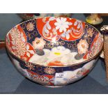 An Imari porcelain bowl with vase of flowers centre, 14" dia