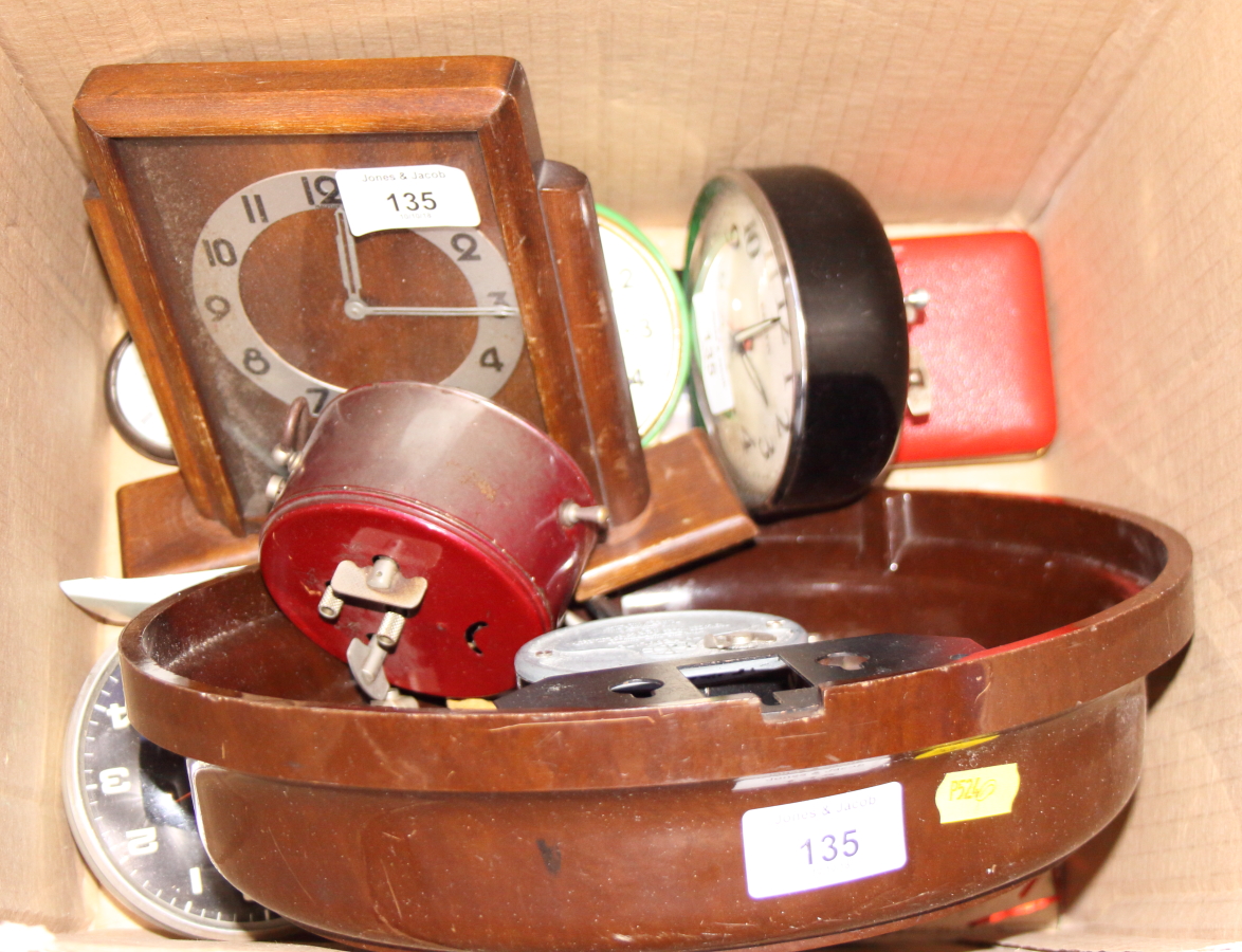 A 1930s Smith of London, eight-day Bakelite wall clock, various mantel clocks, a silver pocket