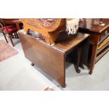 A Georgian mahogany drop leaf dining table, on cabriole supports and pad feet, 40" wide