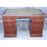 A Holland and Sons late Victorian mahogany twin pedestal desk with inset leather top, top two