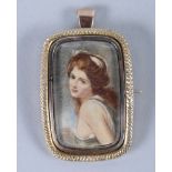 A Georgian yellow metal mounted portrait brooch of a woman, in the style of Joshua Reynolds