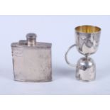 A George V silver hip flask with engine turned decoration, 3 3/4" long, and a George V silver double