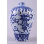 An 18th century Chinese porcelain blue and white vase, decorated figures, buildings and clouds in