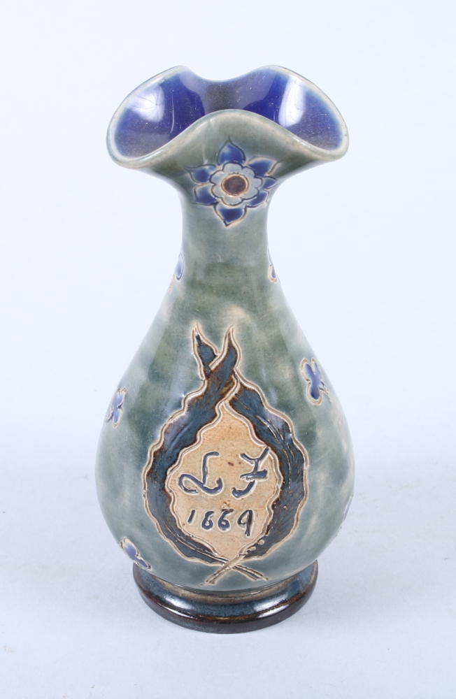 A Doulton Lambeth stoneware vase with incised decoration dated 1669, 5" high