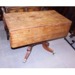 A William IV mahogany Pembroke table, on central column and quadruple splay supports with brass lion