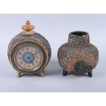 A Doulton Lambeth stoneware clock case with rough cast finish, 7 1/4" high, and a similar vase, 5