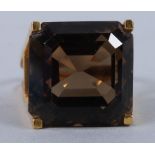 A gold designer ring, with pierced mount, set a large smoky quartz (unmarked) ring size N