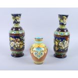 A pair of Doulton Lambeth "faience" floral decorated vases (Richard Dennis Doulton pottery