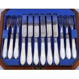 A set of twelve James Dixon and Son silver plated desert knives and forks with reeded mother-of-