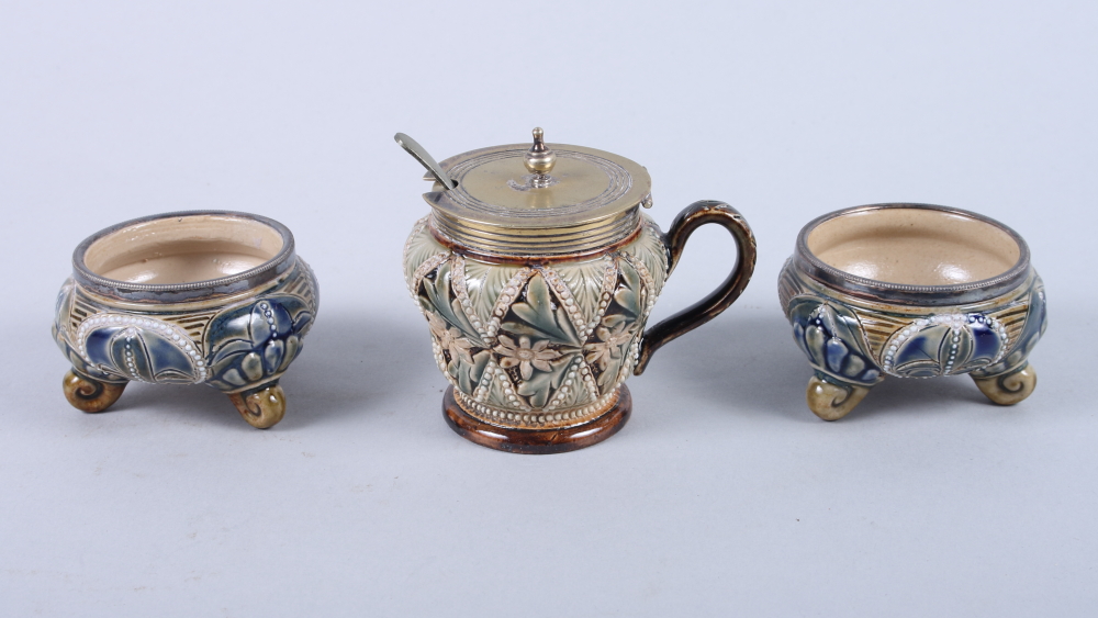 A pair of Doulton Lambeth stoneware salts, on scroll feet, 3" dia, and a similar mustard pot by Mary