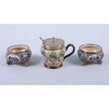 A pair of Doulton Lambeth stoneware salts, on scroll feet, 3" dia, and a similar mustard pot by Mary