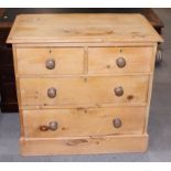 A waxed pine chest of two short and two long drawers, 33" wide