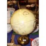 A 12" globe, on brass stand
