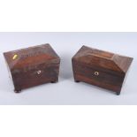 Two 19th century rosewood tea caddies, on ball feet