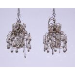 A pair of early 20th century painted metal and cut glass chandelier