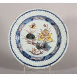 An 18th century London delft polychrome plate with water lily decoration, 8 3/4" dia, c1750