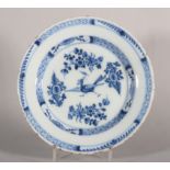 An 18th century English delft plate with chinoiserie strutting bird and flowers decoration, 9"