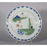 An 18th century Lambeth delft plate with simple landscape and blue dash border, 8 3/4" dia, 1740