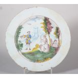 An 18th century Liverpool delft plate with polychrome figures in a landscape centre, 8 6/8" dia (