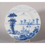 An 18th century Bristol delft plate with landscape with small boats and distant castle decoration, 8