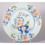 An 18th century English delft plate with polychrome bird, rock and flower decoration, 8 6/8" dia (