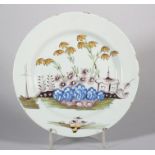 An 18th century Liverpool delft plate with polychrome Oriental landscape decoration, 8 6/8" dia [
