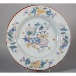An 18th century Liverpool delft plate line drawn precious objects decoration and peony borders, 10
