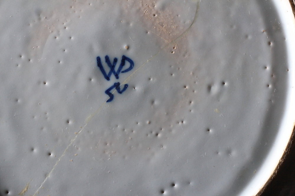 An 18th century Bristol delft charger with spray of flowers and insect decoration, monogram "WP" for - Image 3 of 3